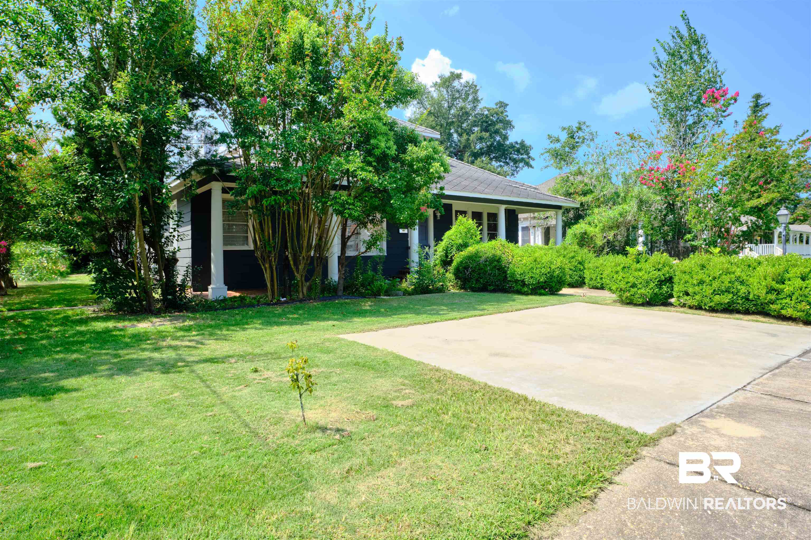 101 West Horner Street Atmore, AL 36502 - Photo 1 of 38 View of property hidden behind natural elements featuring a front lawn