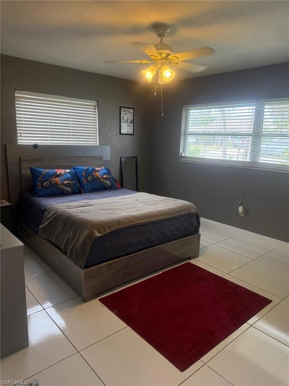 4454 19th Place Southwest Naples, FL 34116 - Photo 17 of 30 a bedroom with a bed and window