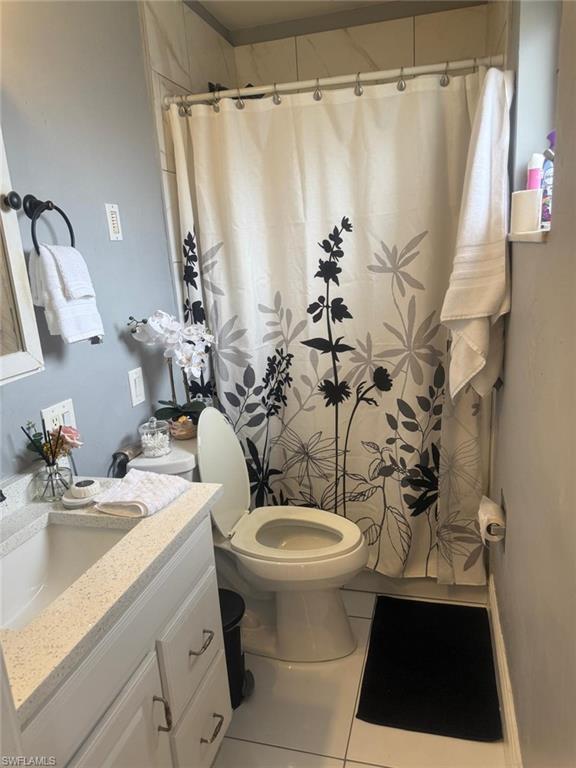 4454 19th Place Southwest Naples, FL 34116 - Photo 23 of 30 a bathroom with a sink toilet and shower