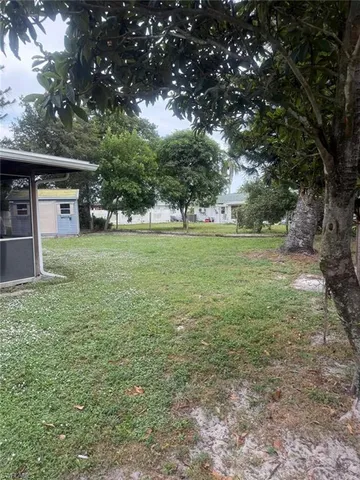 a big yard with lots of green space and deers