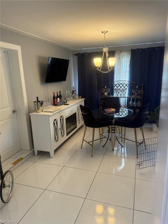 4454 19th Place Southwest Naples, FL 34116 - Photo 6 of 30 a living room with furniture a flat screen tv and a window