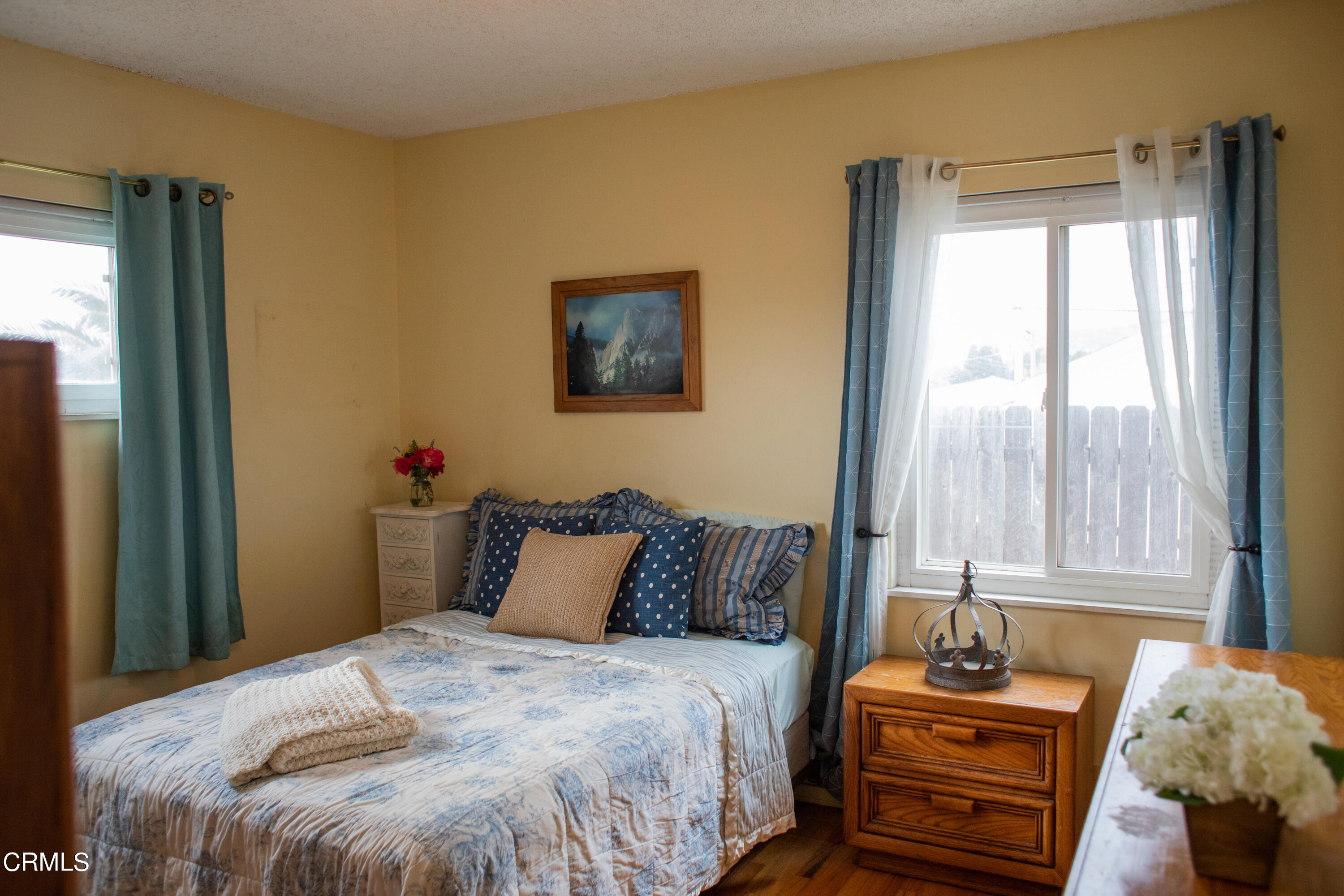 117 Kenneth Street Camarillo, CA 93010 - Photo 15 of 24 a bedroom with a bed and large windows