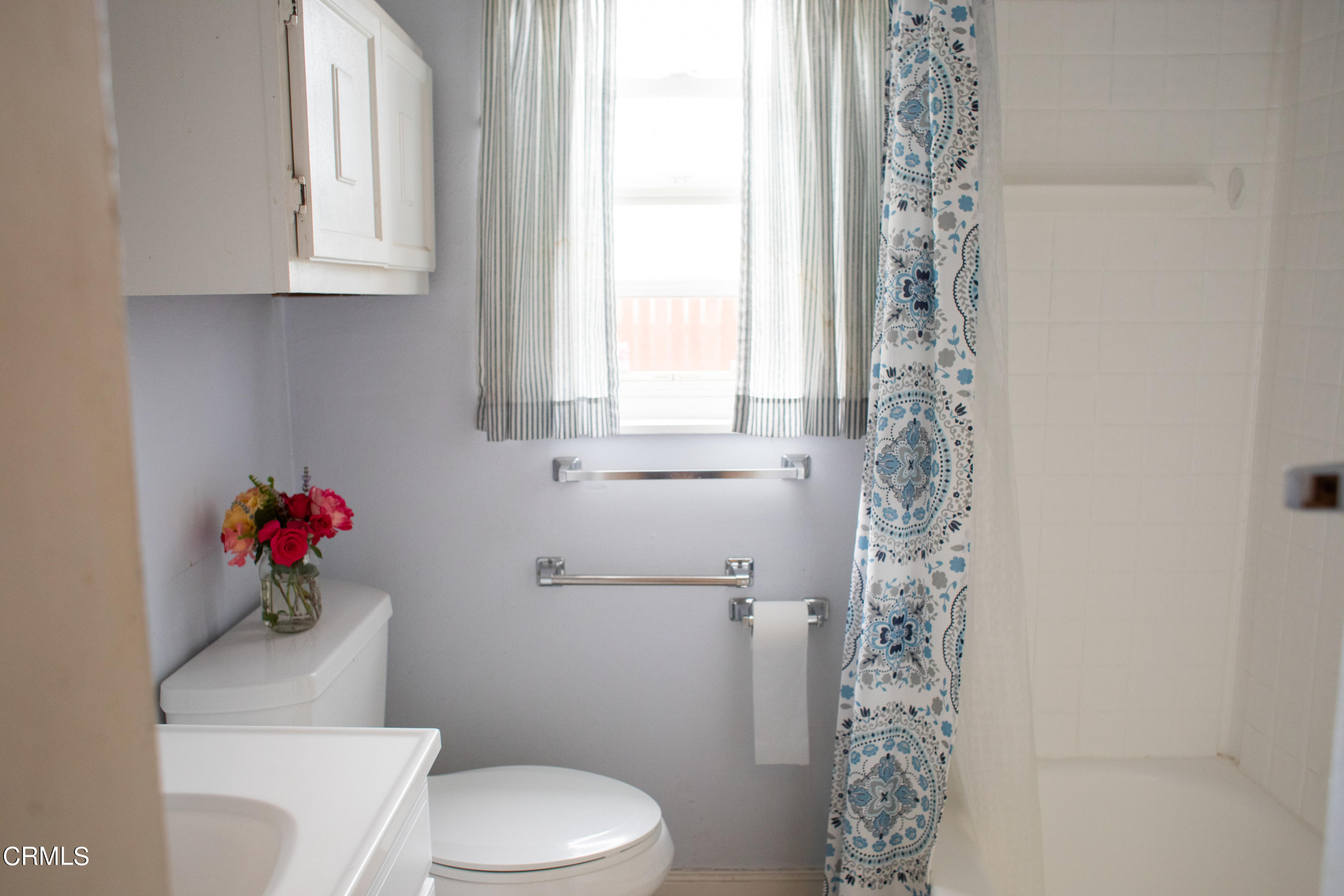 117 Kenneth Street Camarillo, CA 93010 - Photo 16 of 24 a white toilet sitting next to a bathroom sink