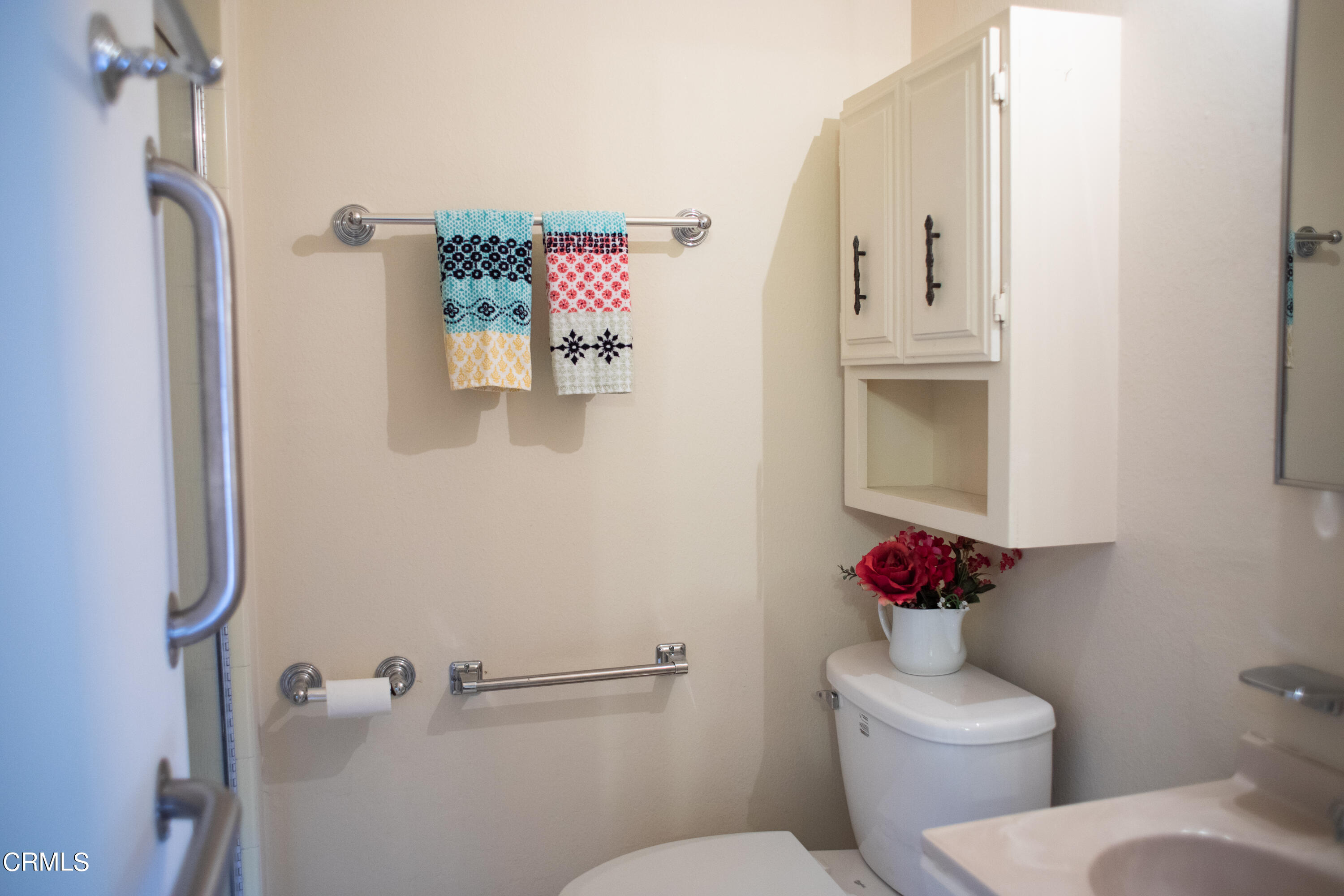 117 Kenneth Street Camarillo, CA 93010 - Photo 19 of 24 a white toilet sitting next to a bathroom sink