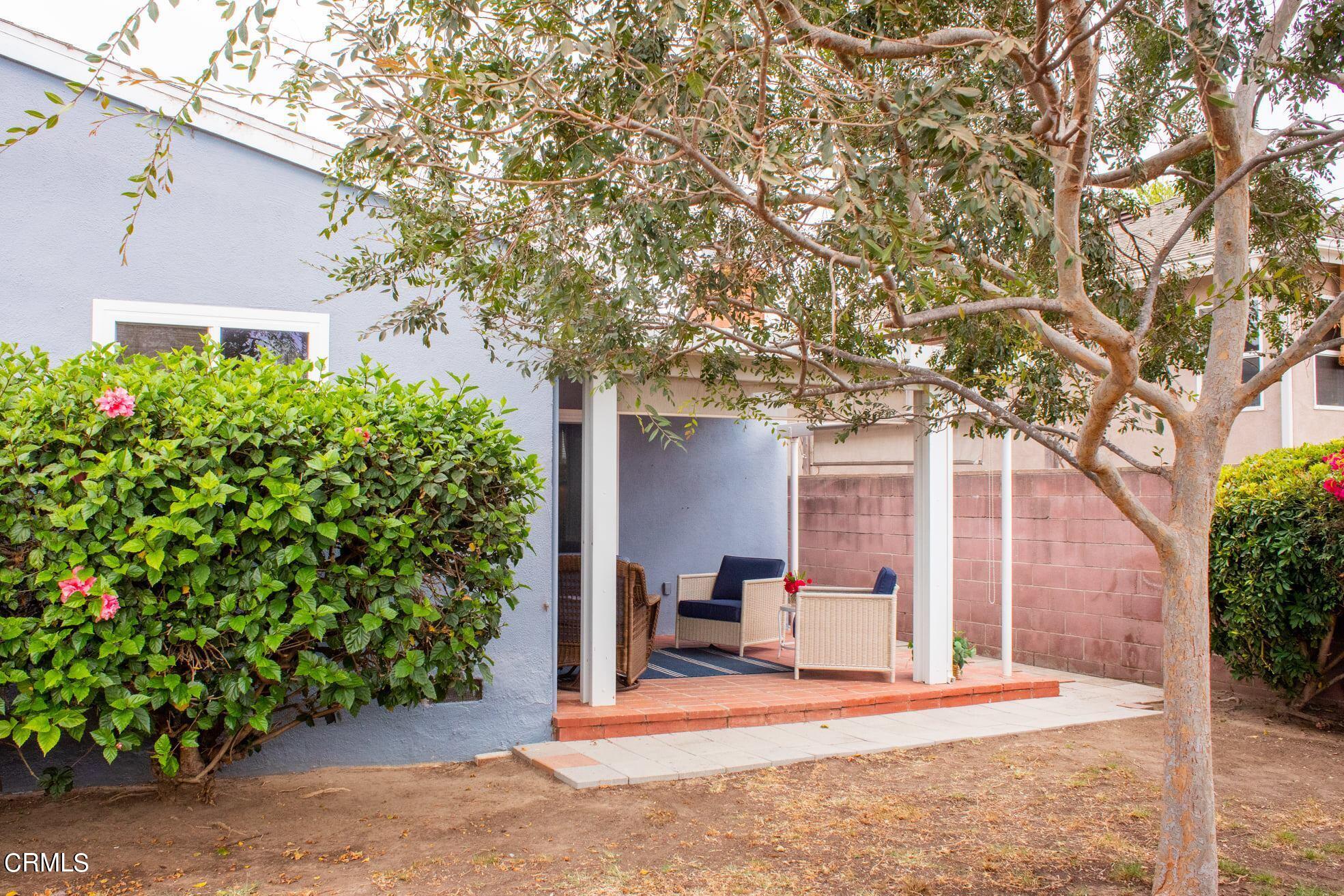 117 Kenneth Street Camarillo, CA 93010 - Photo 23 of 24 a white house that has a tree in front of it