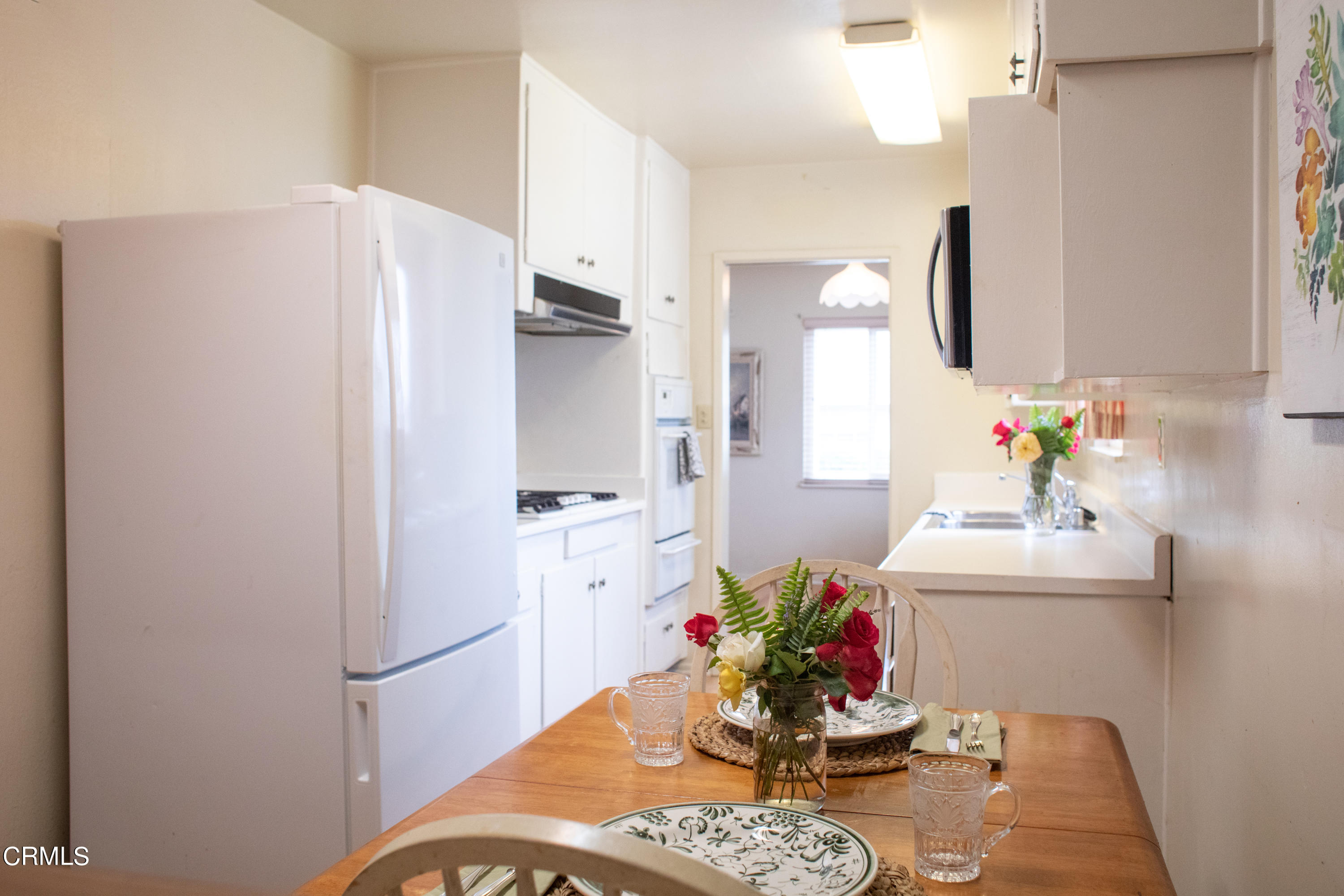 117 Kenneth Street Camarillo, CA 93010 - Photo 8 of 24 a kitchen with stainless steel appliances a refrigerator sink and cabinets