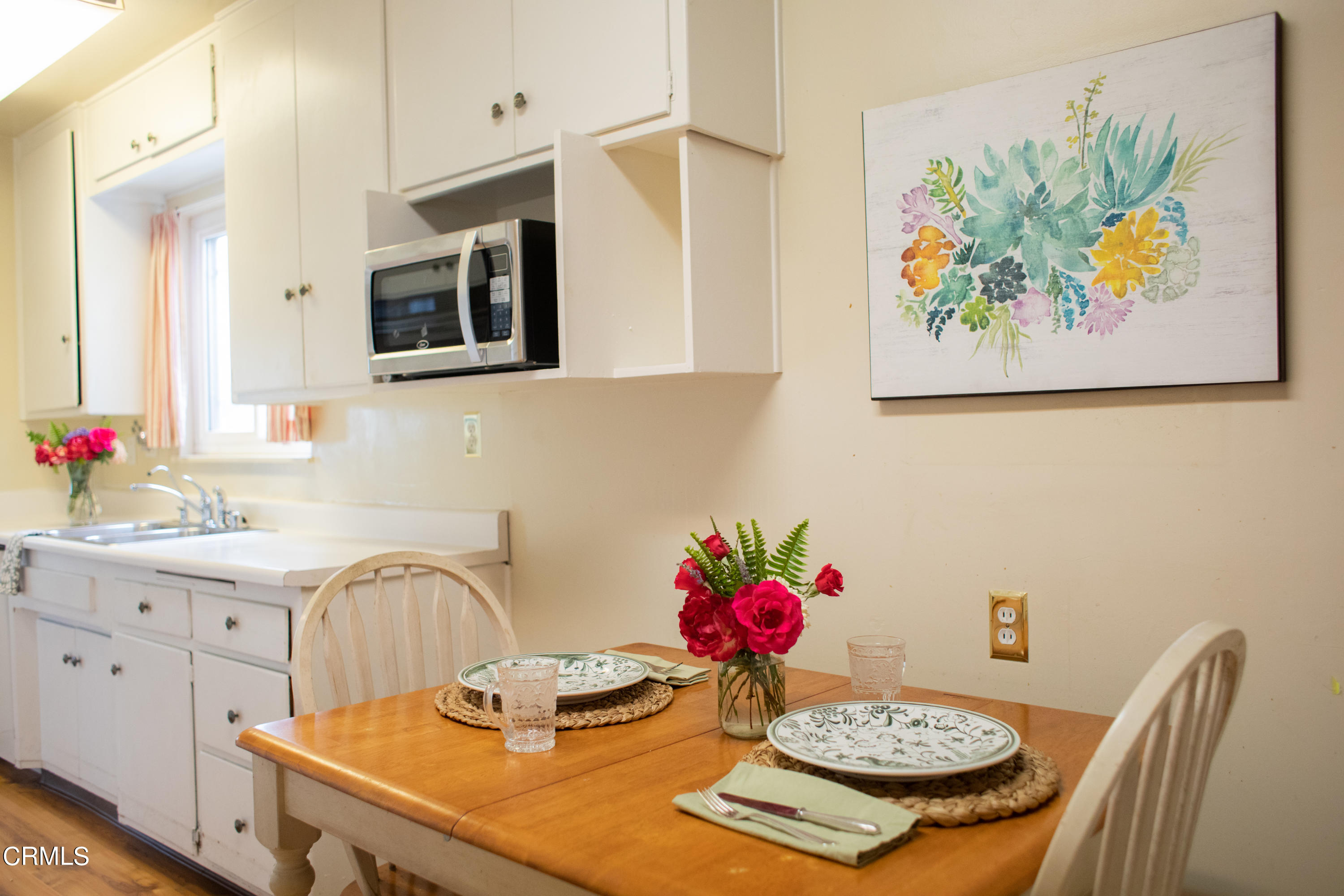 117 Kenneth Street Camarillo, CA 93010 - Photo 9 of 24 a view of a kitchen with a table and chairs