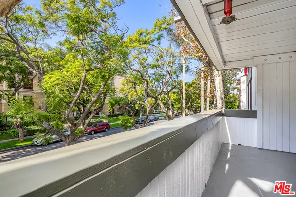 a view of a garden from a balcony