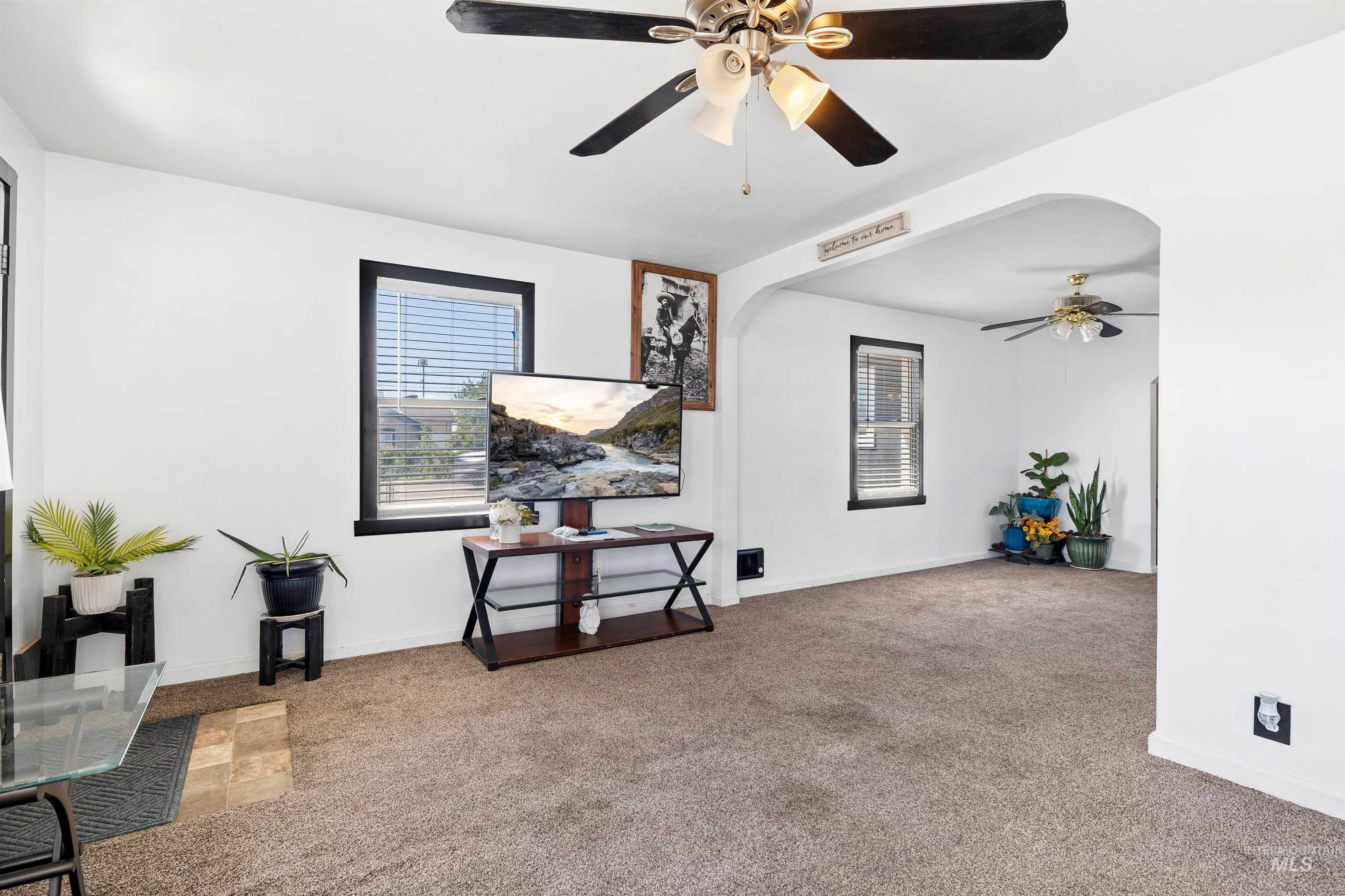 102 East 6th Street Rupert, ID 83350 - Photo 7 of 27 Spacious interior room featuring light brown carpet and white walls