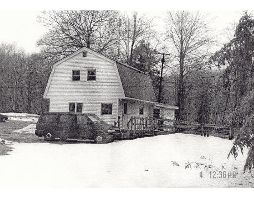 66 Ludwig Branch Road Ashfield, MA 01330 - Photo 1 of 1 a front view of a house with a yard covered in snow