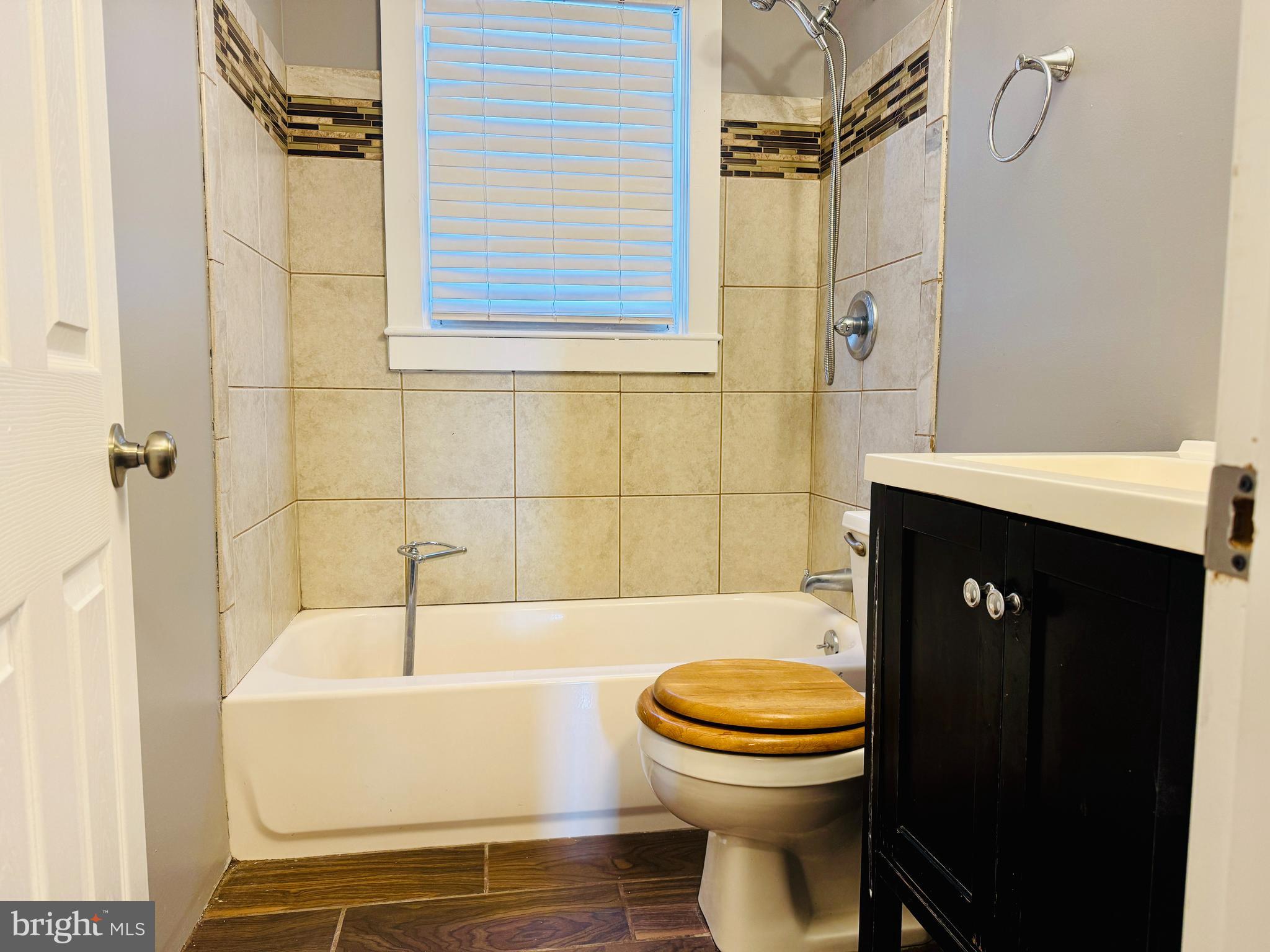 2111 Vailthorn Road Middle River, MD 21220 - Photo 12 of 17 a bathroom with a sink a toilet and shower