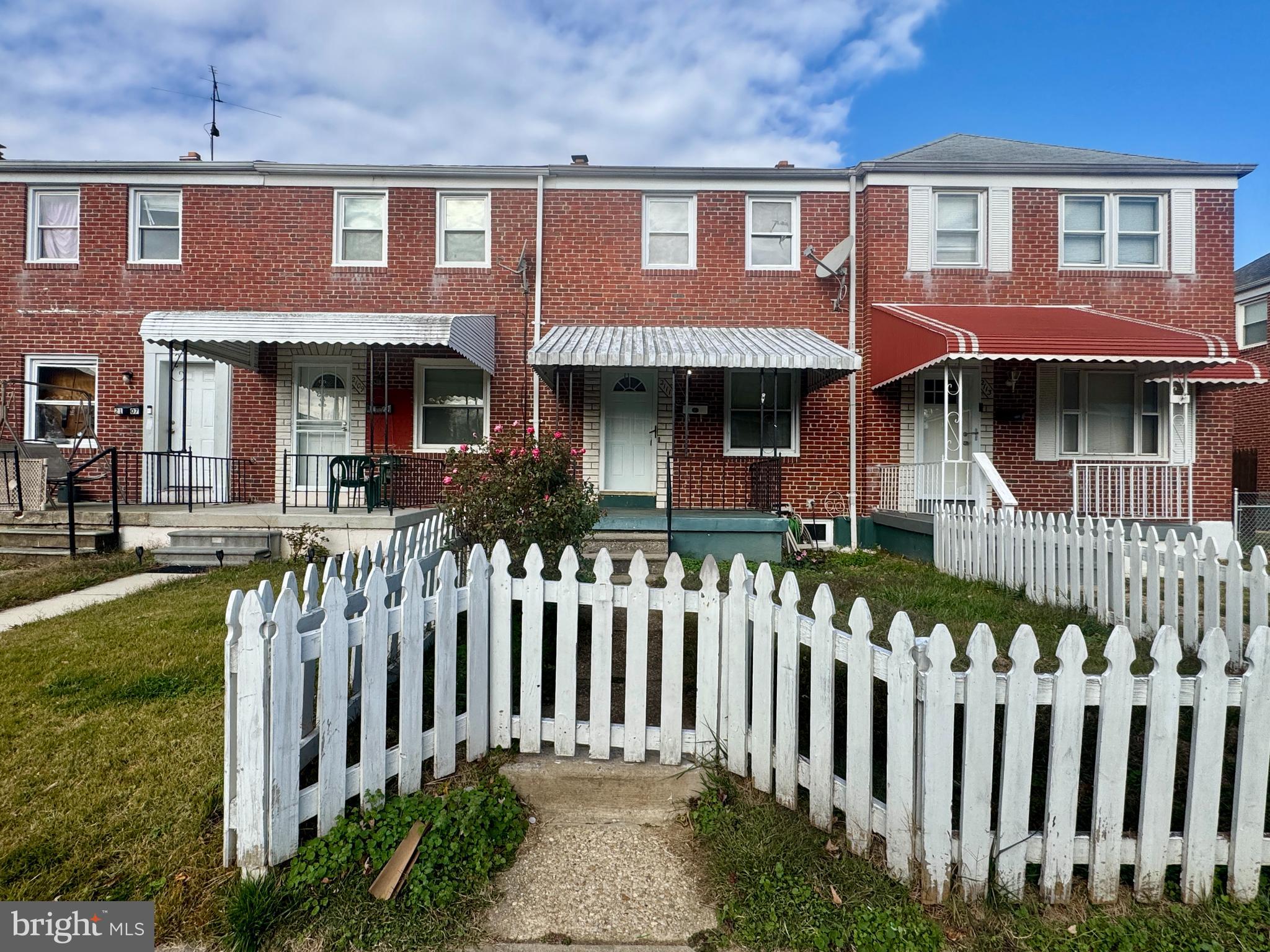 2111 Vailthorn Road Middle River, MD 21220 - Photo 2 of 17 a front view of brick house with a small yard