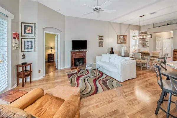 a bedroom with furniture and a flat screen tv