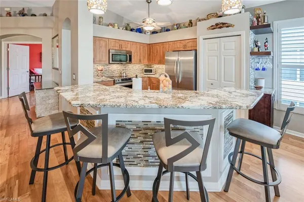 a view of a dining room with furniture and a chandelier