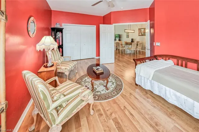 a bedroom with furniture and a wooden floor