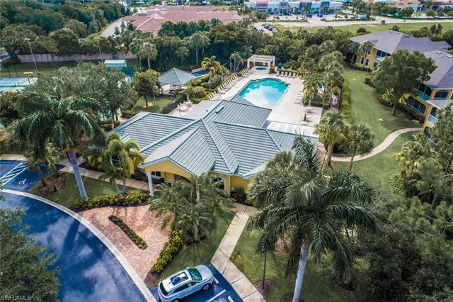 an aerial view of house with yard swimming pool and outdoor seating