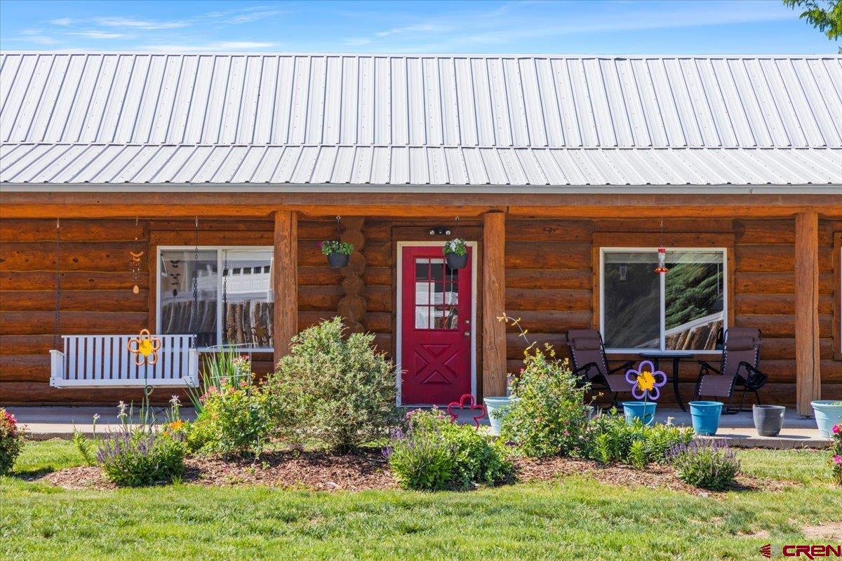 2083 Pioneer Road Delta, CO 81416 - Photo 1 of 45 a front view of a house with garden
