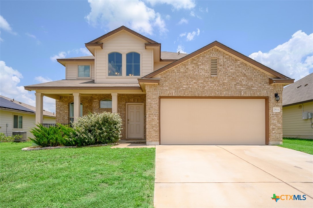 2511 Pintail Loop Copperas Cove, TX 76522 - Photo 2 of 26 a front view of a house with a yard and garage