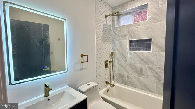 a kitchen with a refrigerator and a sink