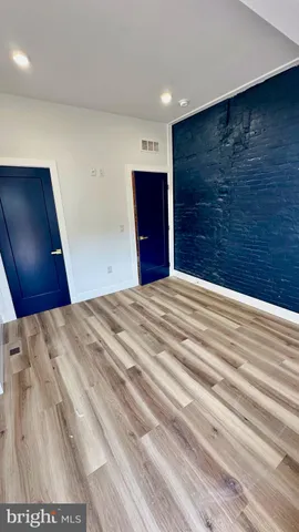 a bathroom with a shower and a sink