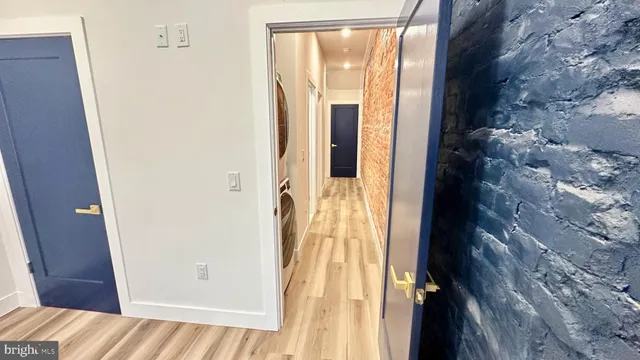 a white toilet sitting next to a bathroom sink and vanity