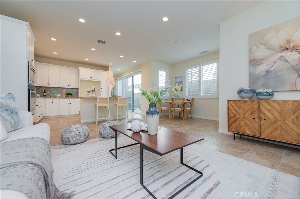 184 Terrapin Irvine, CA 92618 - Photo 11 of 74 a living room with furniture and kitchen view