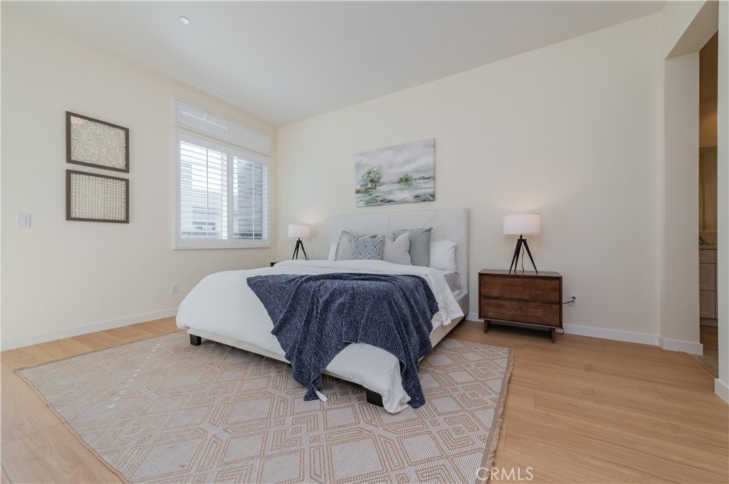 184 Terrapin Irvine, CA 92618 - Photo 20 of 74 a spacious bedroom with a bed and window