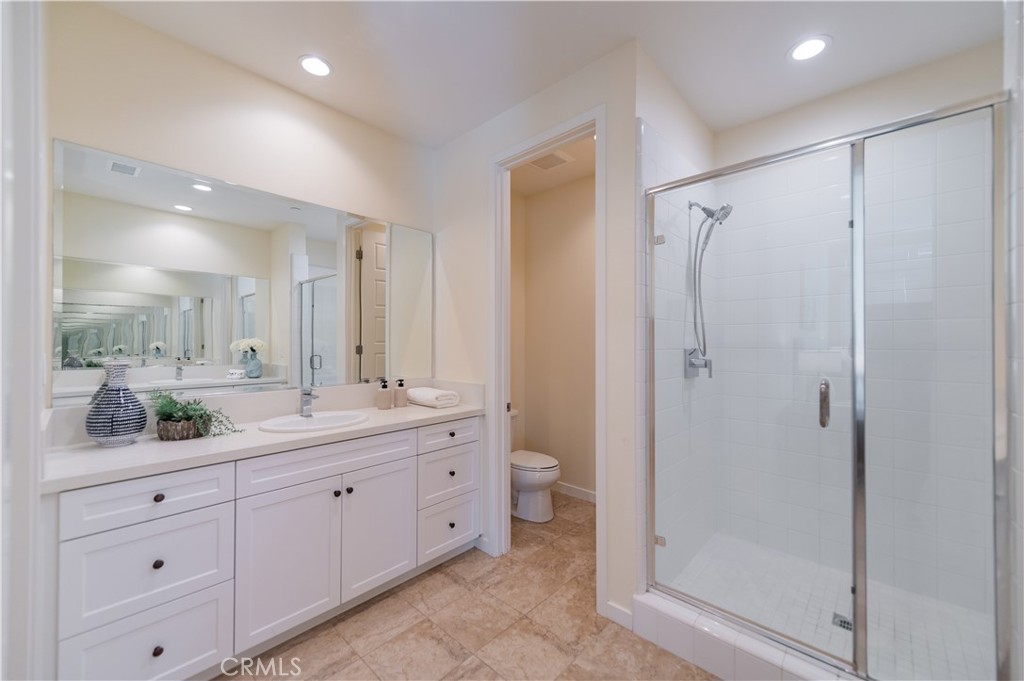 184 Terrapin Irvine, CA 92618 - Photo 24 of 74 a bathroom with a double vanity sink mirror and shower