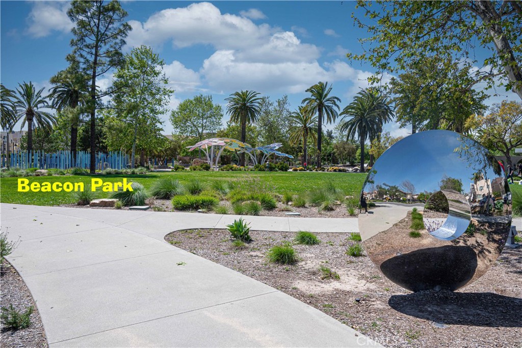 184 Terrapin Irvine, CA 92618 - Photo 47 of 74 a view of a garden with a table and chairs under an umbrella