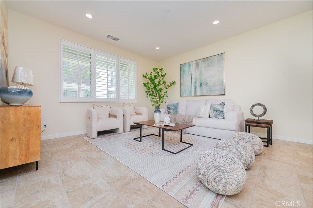 184 Terrapin Irvine, CA 92618 - Photo 8 of 74 a living room with furniture and a potted plant
