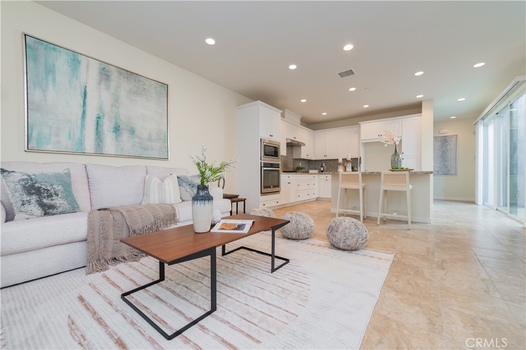 184 Terrapin Irvine, CA 92618 - Photo 10 of 74 a living room with furniture and kitchen view