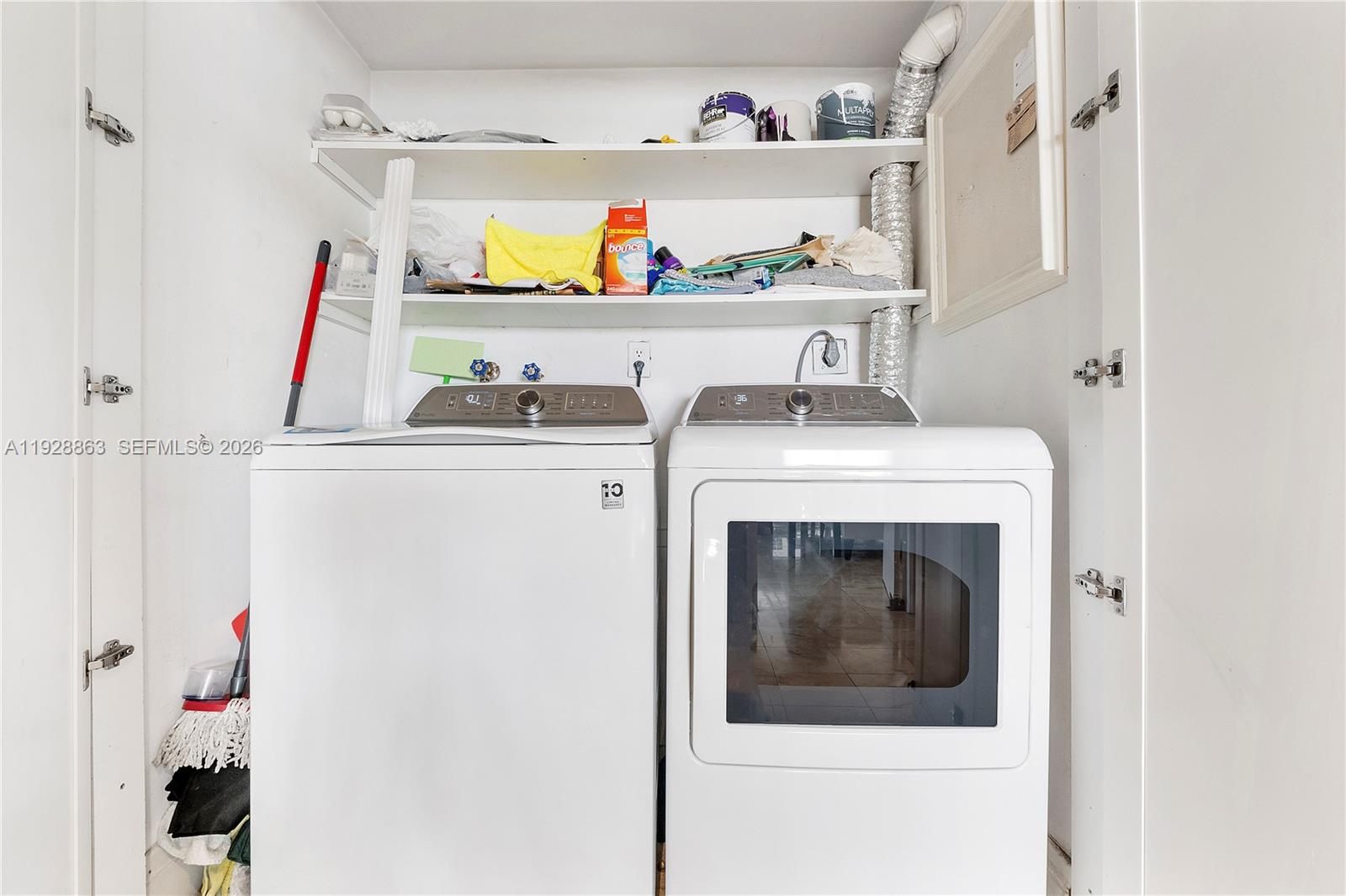 2 Grove Isle Drive, Unit B1110 Miami, FL 33133 - Photo 16 of 29 a utility room with dryer and washer