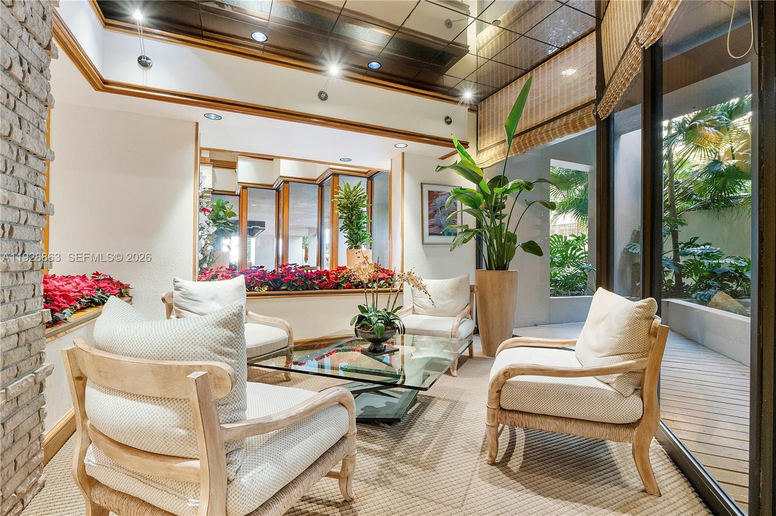 2 Grove Isle Drive, Unit B1110 Miami, FL 33133 - Photo 24 of 29 a living room with furniture and floor to ceiling windows