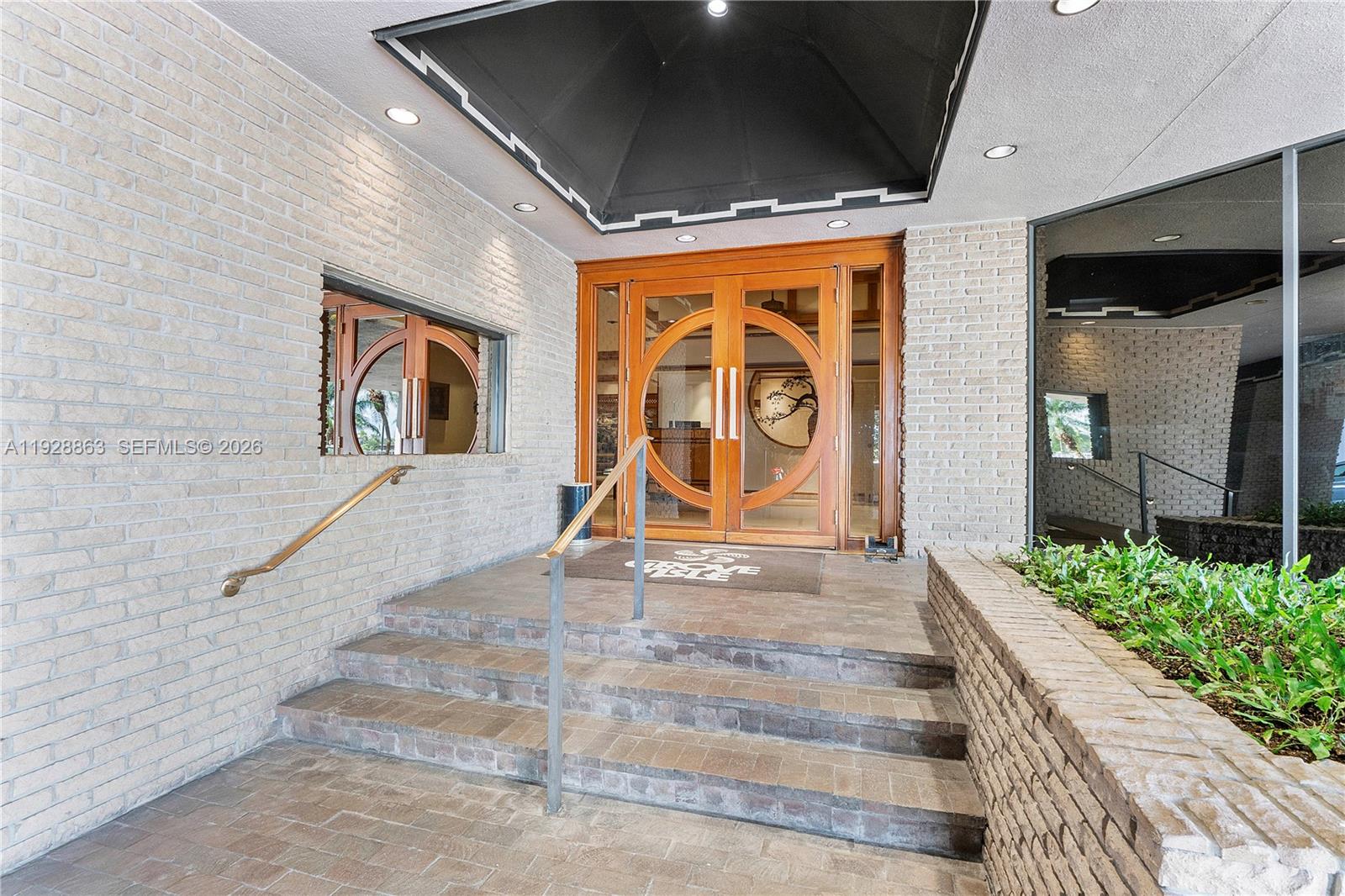 2 Grove Isle Drive, Unit B1110 Miami, FL 33133 - Photo 28 of 29 a view of entrance gate of the house with stairs