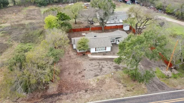 an aerial view of residential house with outdoor space