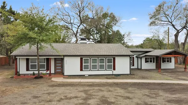 a house with trees in the background
