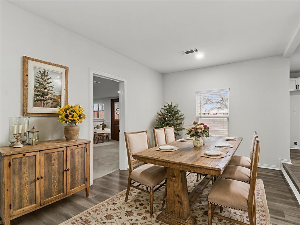 521 South Main Street Dawson, TX 76639 - Photo 6 of 19 Dining area with dark wood-style flooring and baseboards