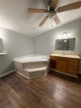 a room with furniture and a ceiling fan