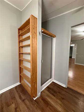 a view of front door with wooden floor