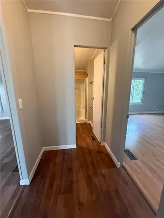 wooden floor in an empty room with a mirror