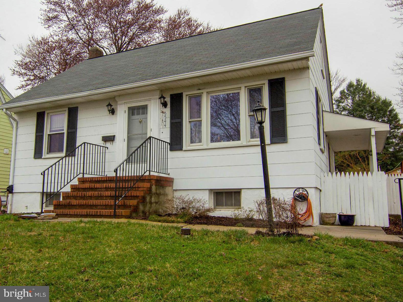 5544 Gayland Road Baltimore, MD 21227 - Photo 1 of 24 a front view of a house with a yard