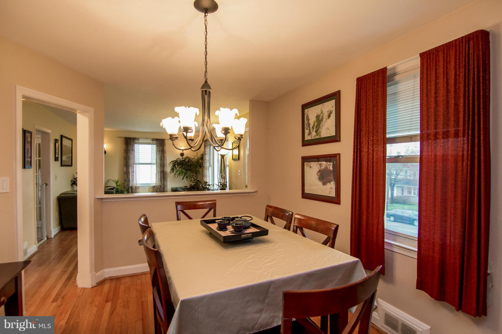5544 Gayland Road Baltimore, MD 21227 - Photo 2 of 24 a view of a dining room with furniture window and wooden floor