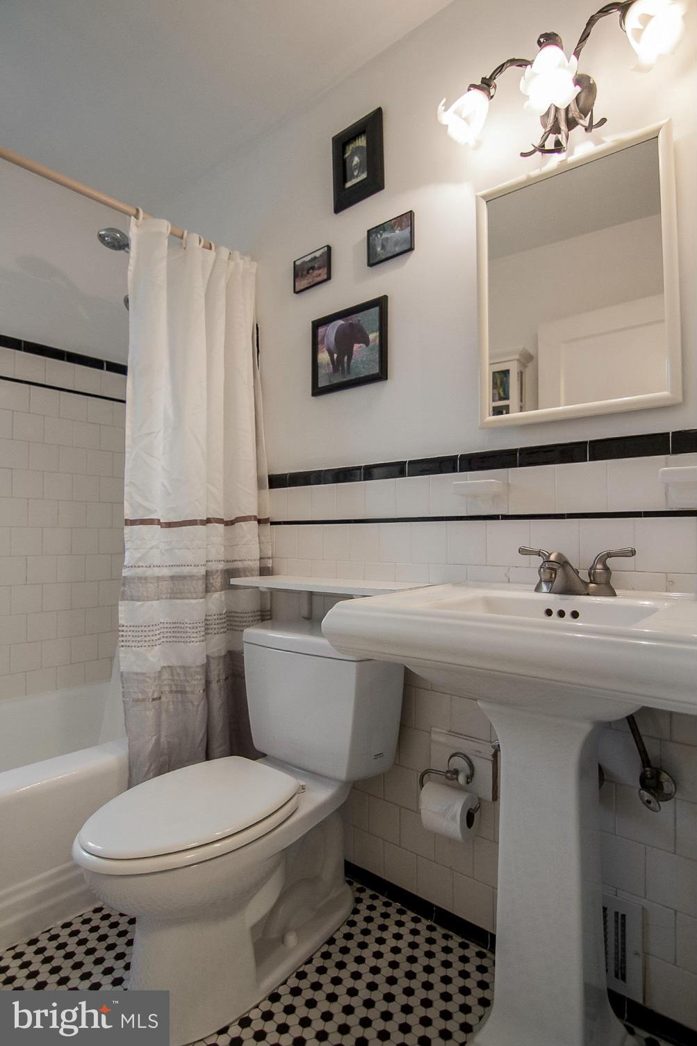 5544 Gayland Road Baltimore, MD 21227 - Photo 14 of 24 a bathroom with a sink a toilet and shower