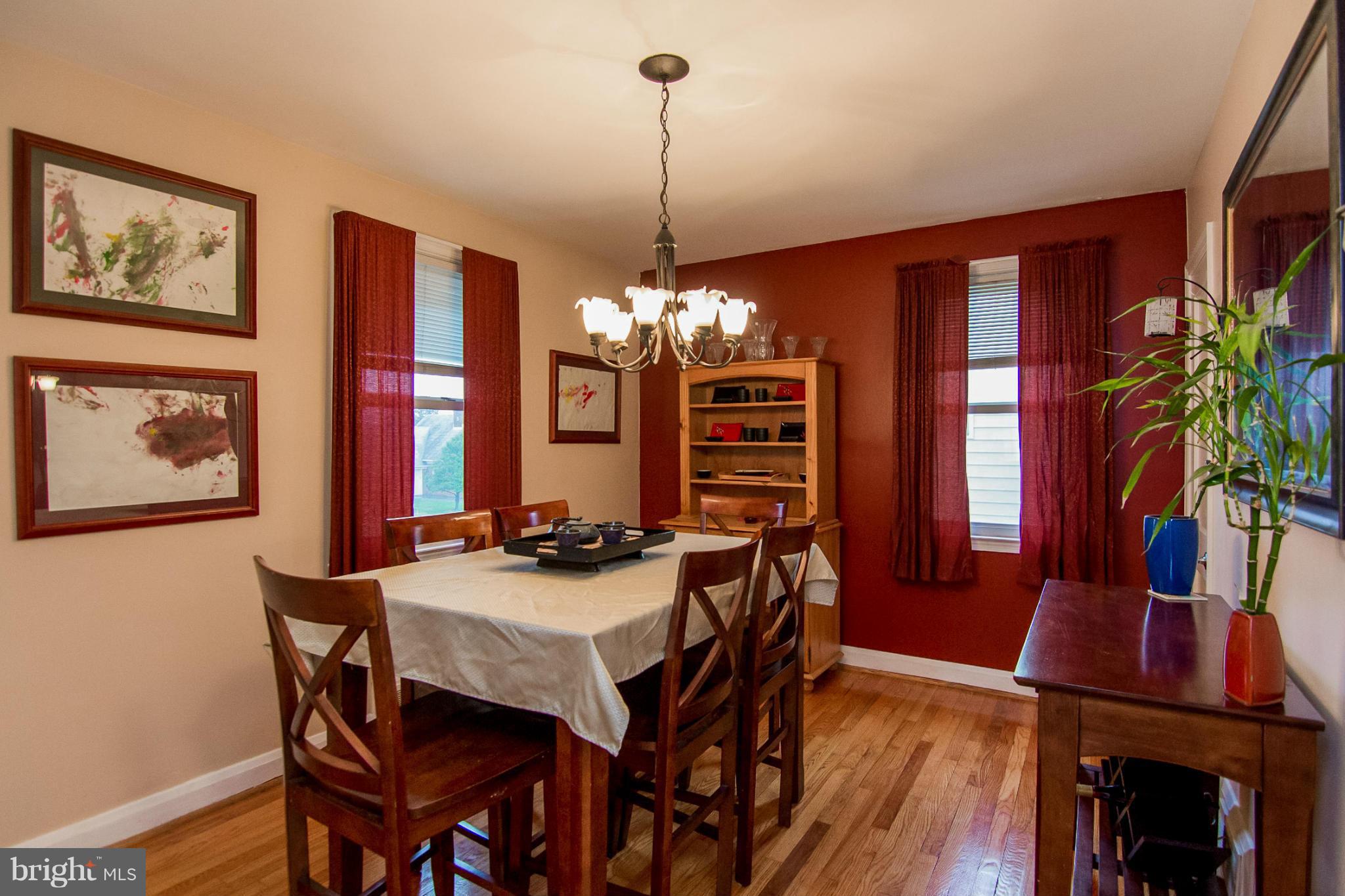 5544 Gayland Road Baltimore, MD 21227 - Photo 3 of 24 a view of a dining room with furniture window and wooden floor