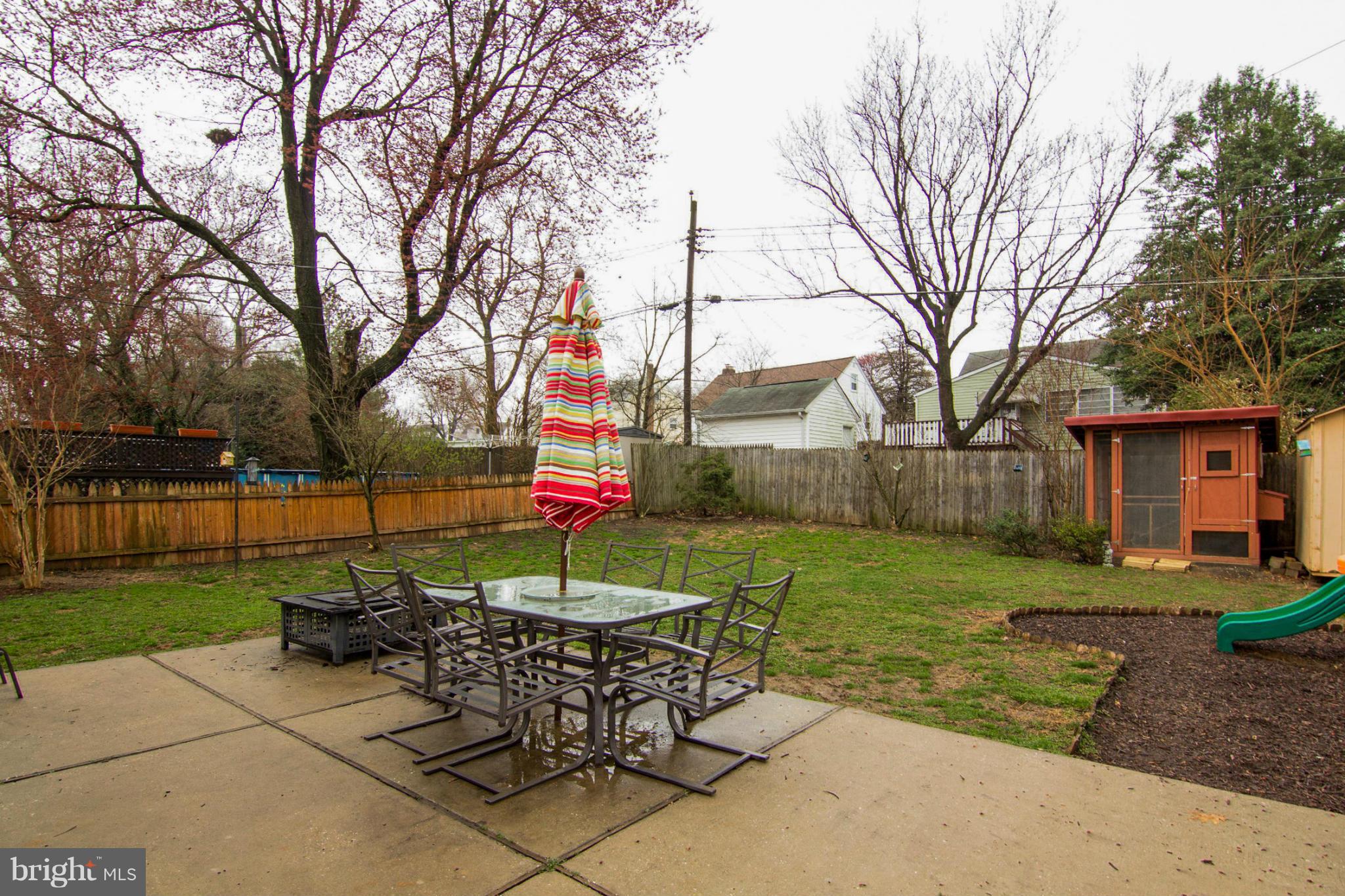 5544 Gayland Road Baltimore, MD 21227 - Photo 22 of 24 a table and chairs sitting in the middle of yard