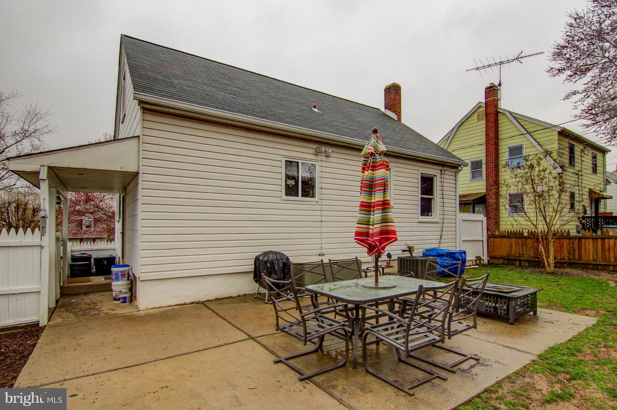 5544 Gayland Road Baltimore, MD 21227 - Photo 23 of 24 a backyard of a house with table and chairs