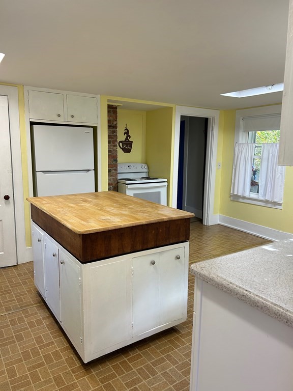 2038 Maple Street Three Rivers, MA 01080 - Photo 6 of 24 a kitchen with granite countertop a oven and a refrigerator