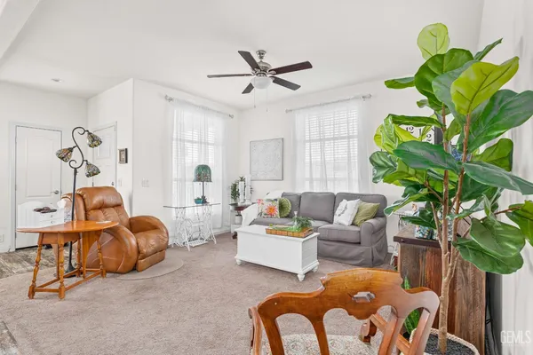 a living room with furniture a chandelier