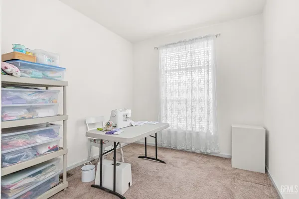 a workspace with furniture and window