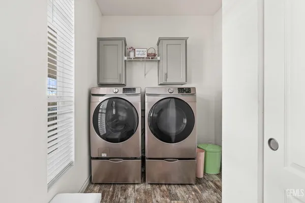 a bathroom with a sink a washer and dryer